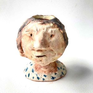 Woman's head vase b. small smile/frown