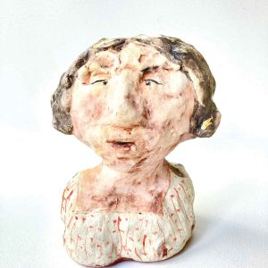 Woman's head vase c. large smile/frown